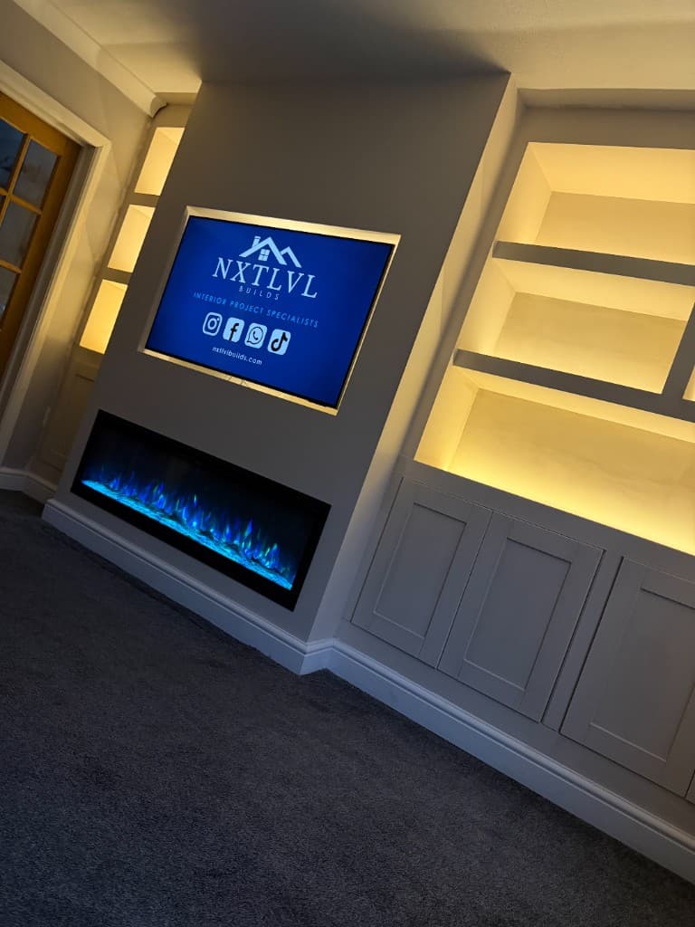 Media wall with integrated fireplace and LED shelving